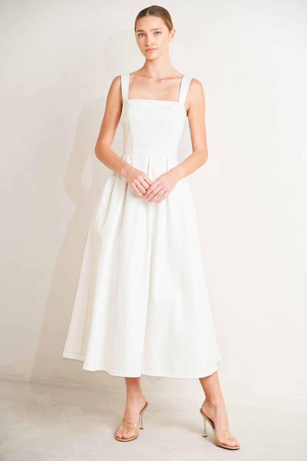 
A solid woven midi dress featuring straight neckline, straps, full skirt and back zipper closure

Details:

Self : 100% Cotton

Size &amp; Fit

- Model is 5`8" And Wearing Size Small
- Measurements Taken From Size Small
- Approx. Length: 50"