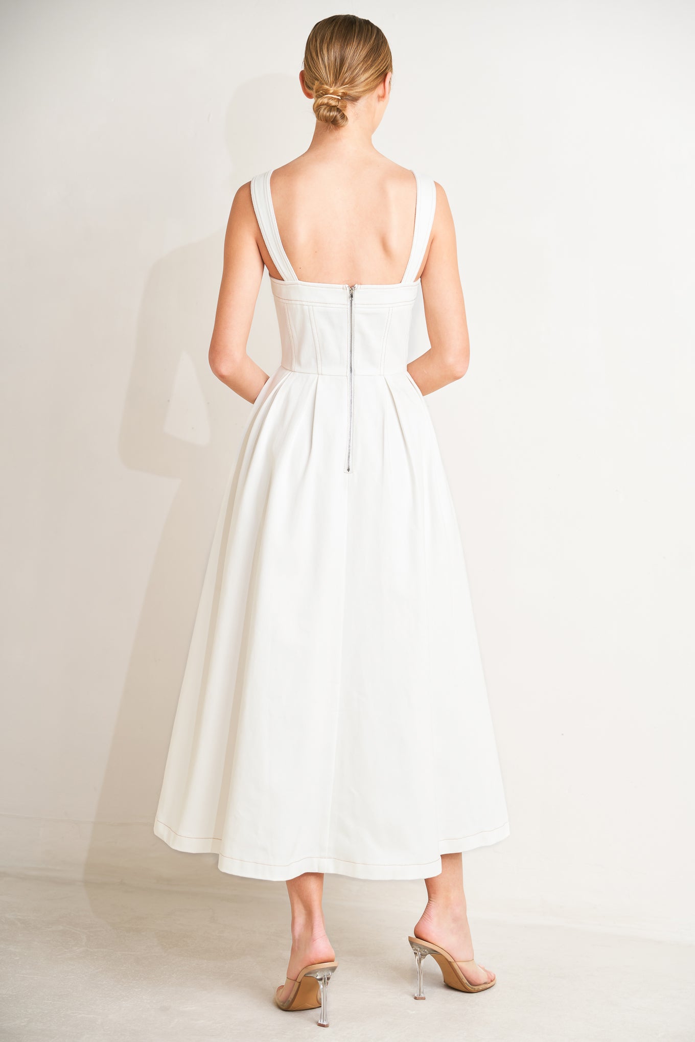 
A solid woven midi dress featuring straight neckline, straps, full skirt and back zipper closure

Details:

Self : 100% Cotton

Size &amp; Fit

- Model is 5`8" And Wearing Size Small
- Measurements Taken From Size Small
- Approx. Length: 50"