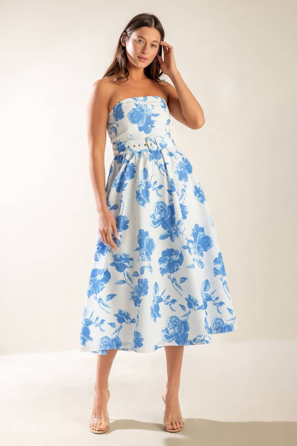 A strapless white and blue printed textured woven midi dress featuring self belt and full skirt.