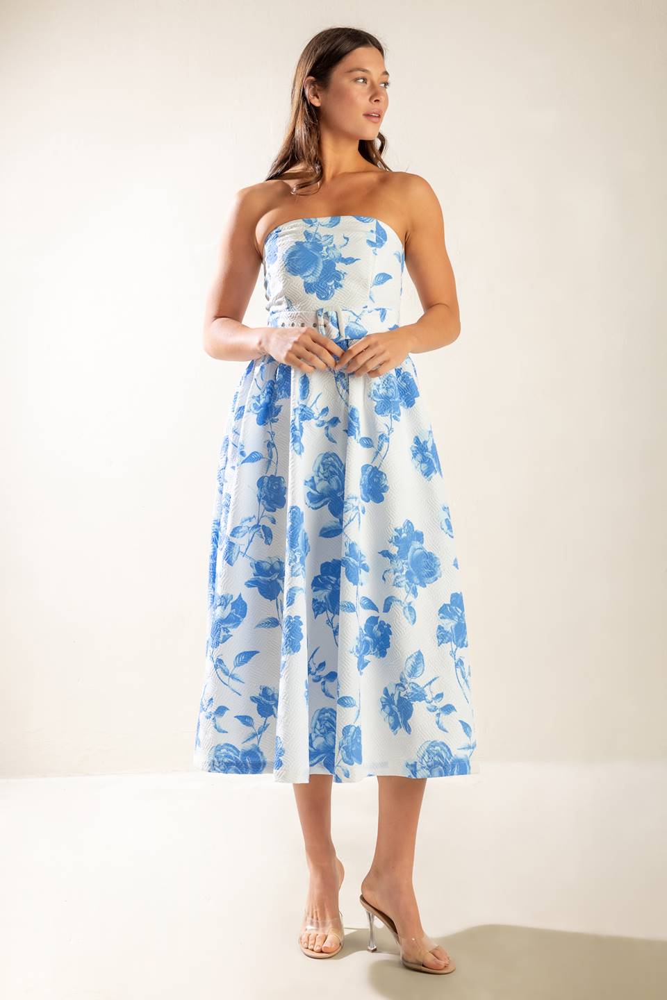 A strapless white and blue printed textured woven midi dress featuring self belt and full skirt.