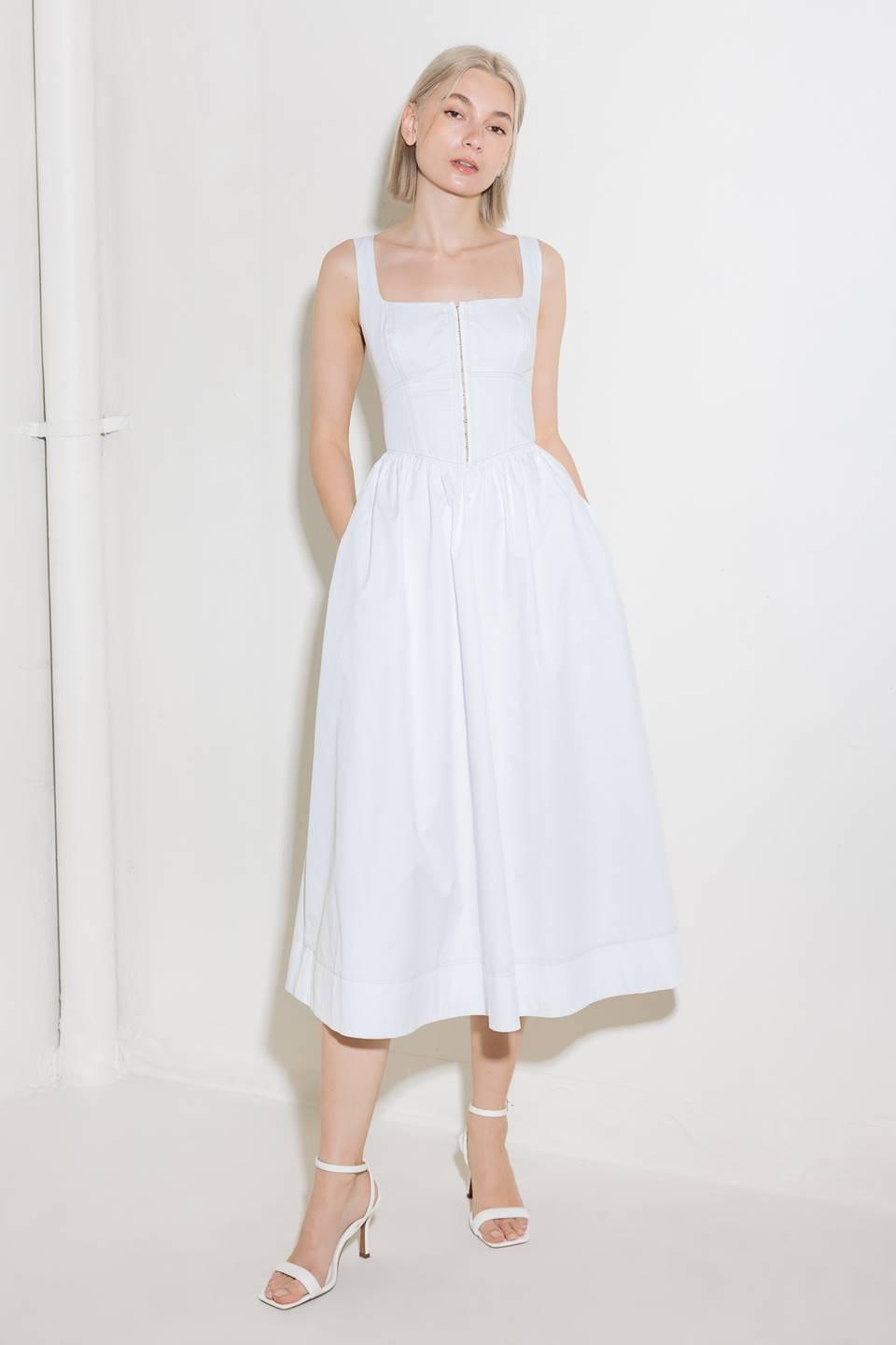 A solid woven midi dress featuring square neckline, sleeveless, front hook and  eye closure, full skirt and back zipper closure.