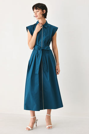 Woman wearing a teal midi dress featuring collar, short sleeve, front zipper closure and self sash tie | FREEMARKET