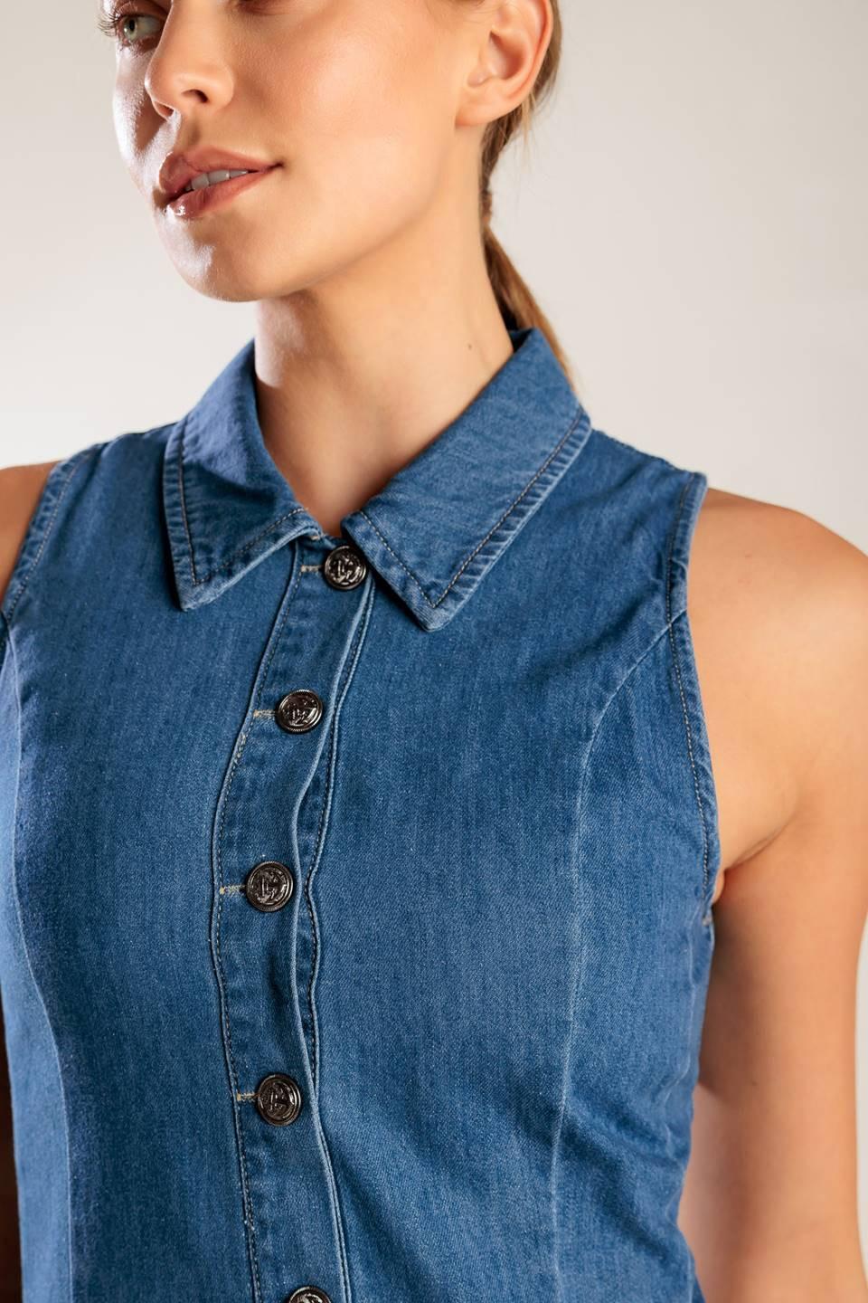 A washed denim mini dress featuring collar, button down, fitted waist and inverted pleats