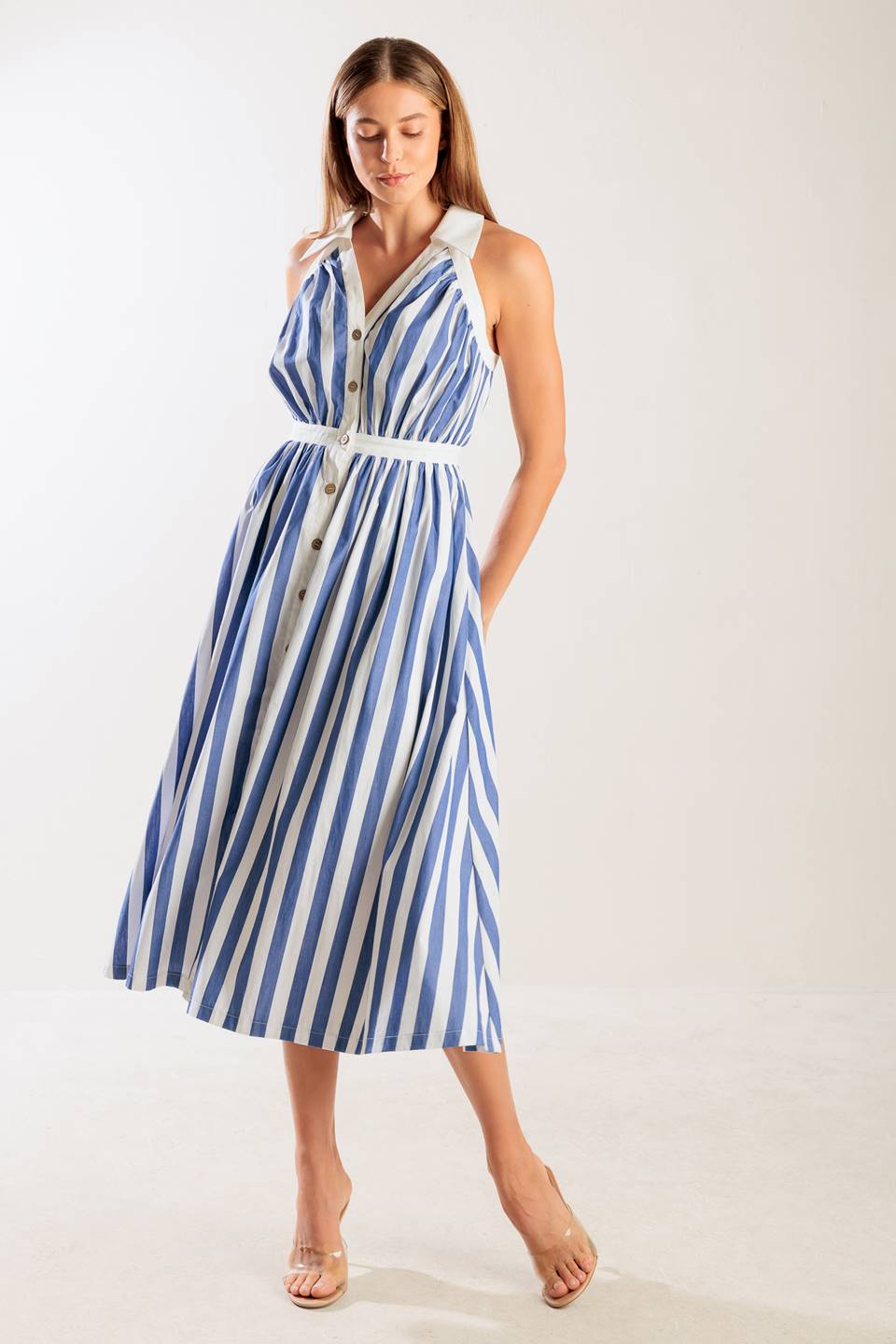 A navy and white striped woven midi dress featuring collar, V neckline, button down, and full skirt.