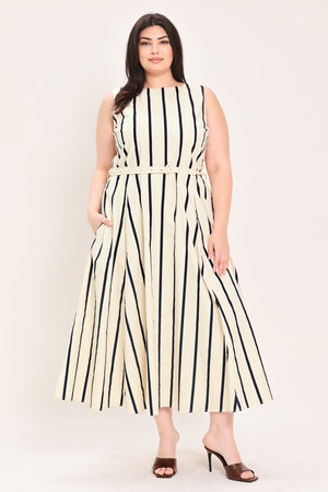 Woman wearing a navy and white striped midi dress featuring wide neckline, sleeveless, self belt, full skirt, low back with zipper closure | FREEMARKET