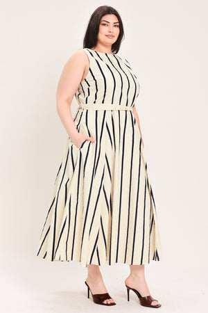 Woman wearing a navy and white striped midi dress featuring wide neckline, sleeveless, self belt, full skirt, low back with zipper closure | FREEMARKET