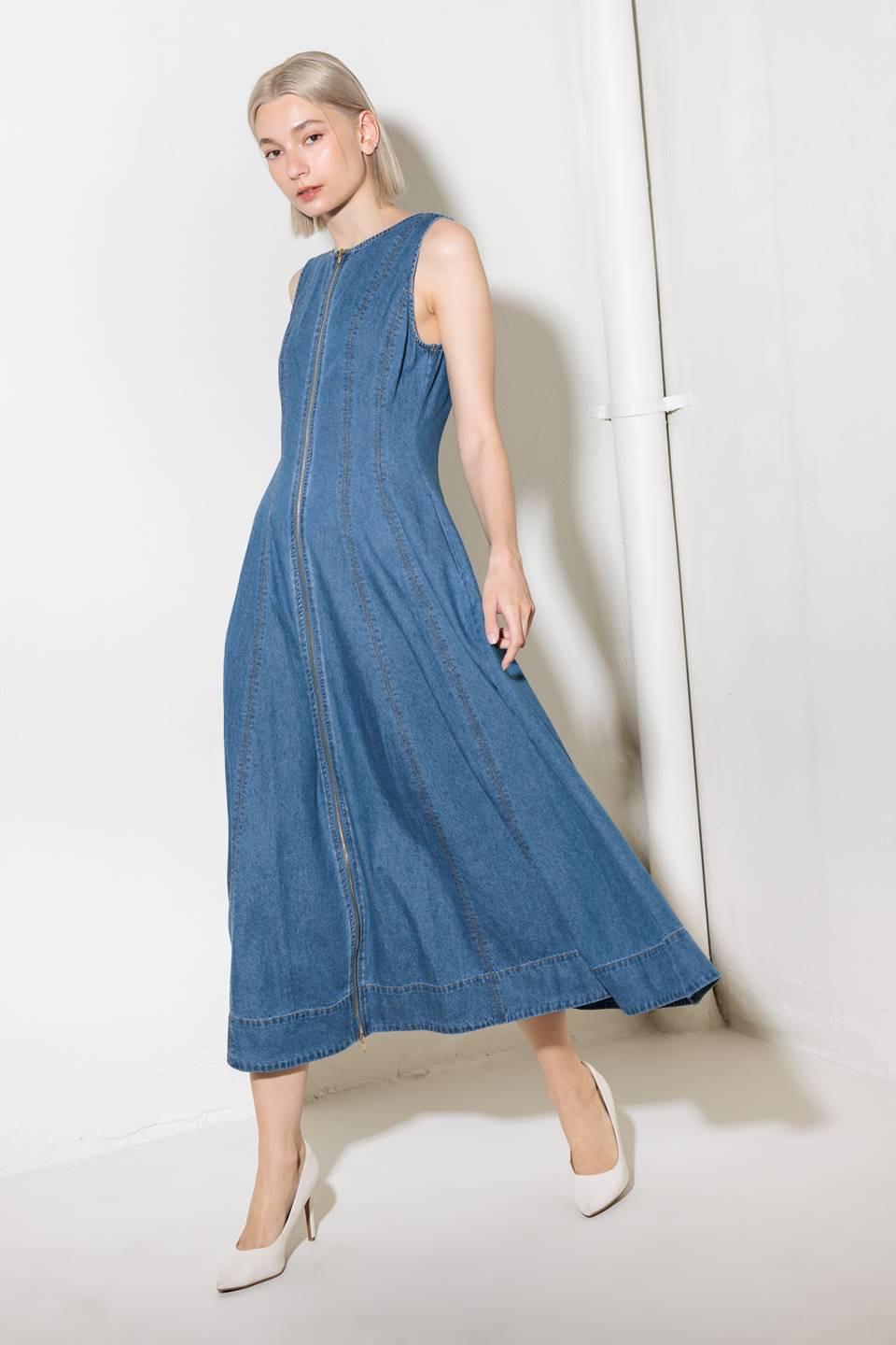 A washed denim midi dress featuring round neckline, sleeveless and front zipper closure.