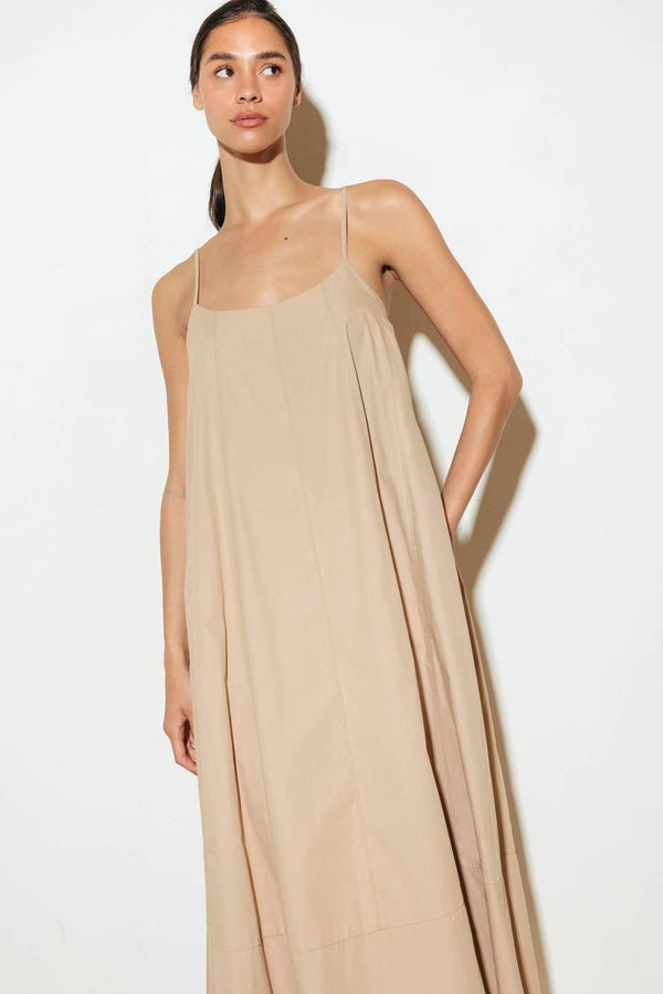 Crafted with a solid woven texture and a stylish taupe hue, this midi tent dress offers a versatile addition to your wardrobe. Featuring a convenient back strap closure, it's a functional and chic option for any occasion.