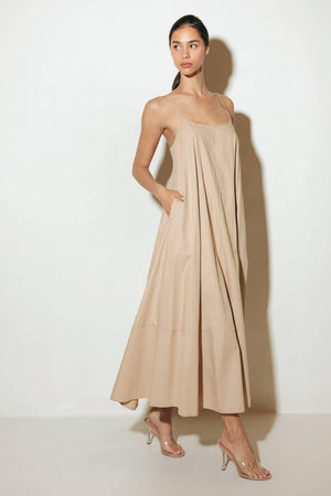 Crafted with a solid woven texture and a stylish taupe hue, this midi tent dress offers a versatile addition to your wardrobe. Featuring a convenient back strap closure, it's a functional and chic option for any occasion.