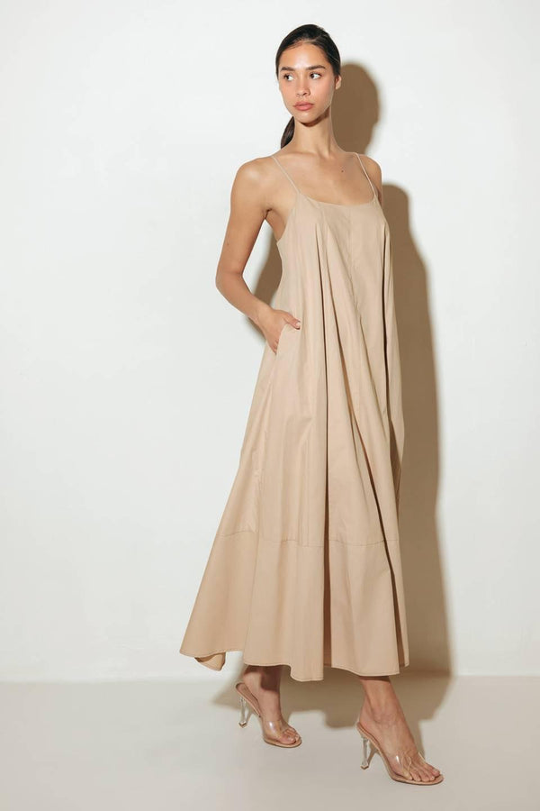 Crafted with a solid woven texture and a stylish taupe hue, this midi tent dress offers a versatile addition to your wardrobe. Featuring a convenient back strap closure, it's a functional and chic option for any occasion.