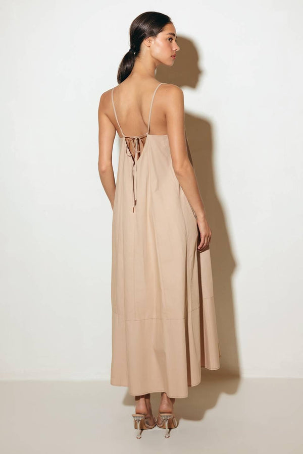 Crafted with a solid woven texture and a stylish taupe hue, this midi tent dress offers a versatile addition to your wardrobe. Featuring a convenient back strap closure, it's a functional and chic option for any occasion.