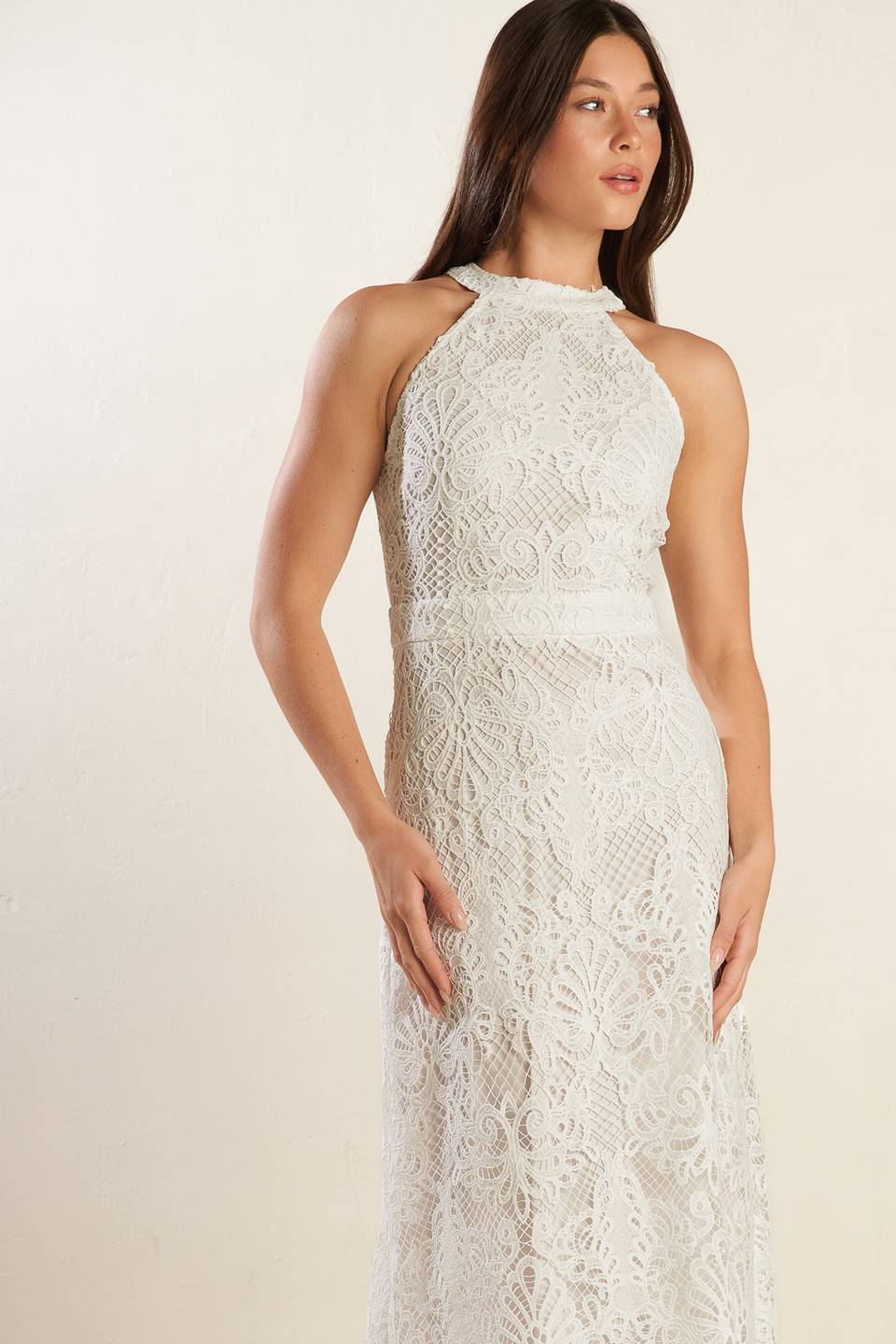 A white woven lace midi dress featuring halter neckline, A-line skirt and back zipper closure.