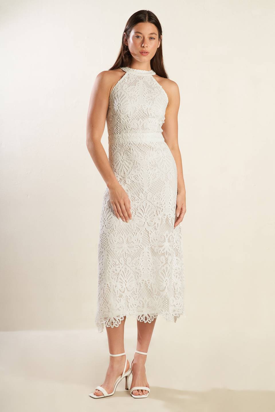 A white woven lace midi dress featuring halter neckline, A-line skirt and back zipper closure.