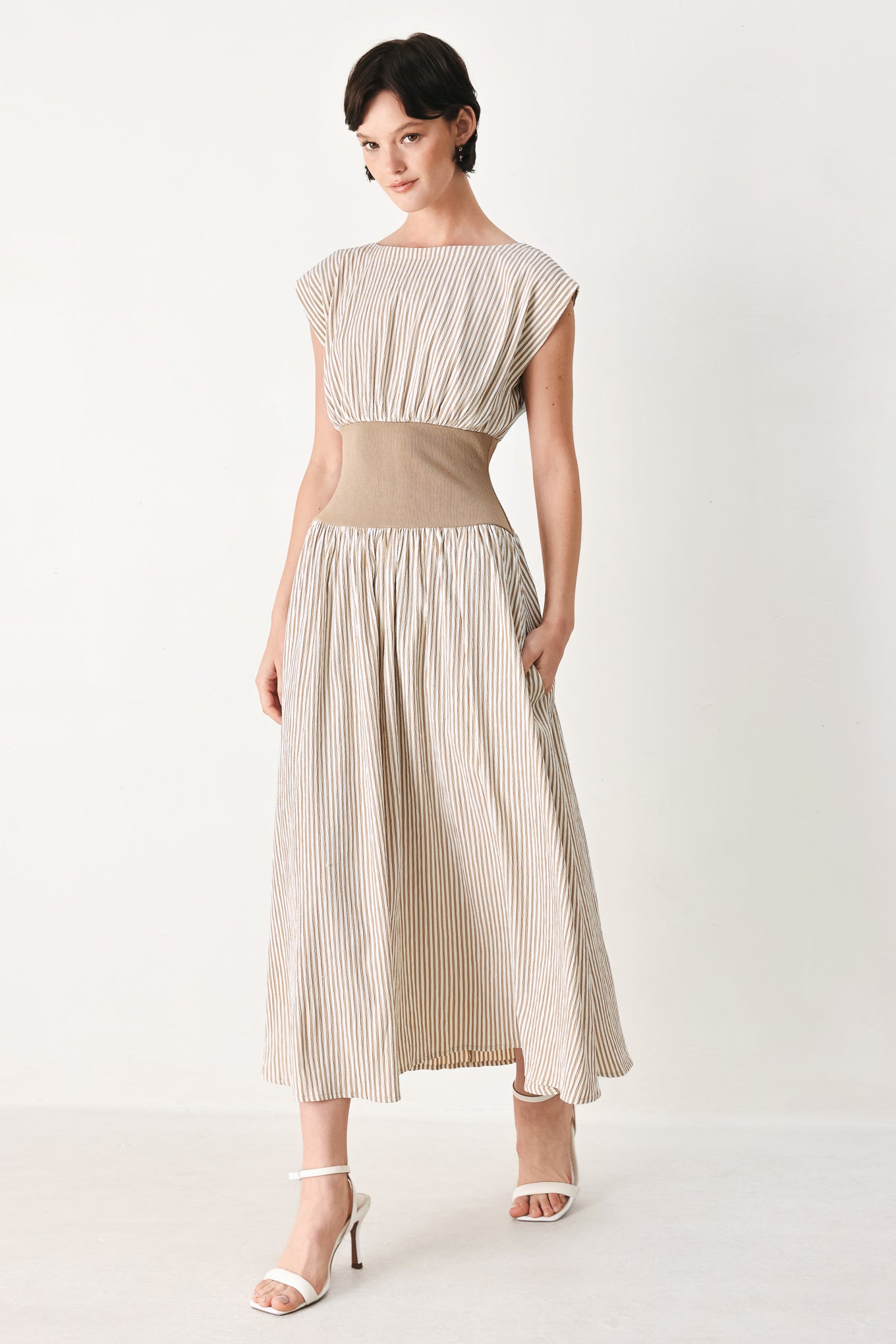 Woman wearing a beige mocha and white cream striped midi dress midi dress featuring wide neckline, cap sleeve, wide ribbed knit waist, full skirt and back zipper | FREEMARKET