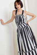 A striped woven midi dress featuring straight neckline, elasticized waist, bare back with cross strap and tie closure