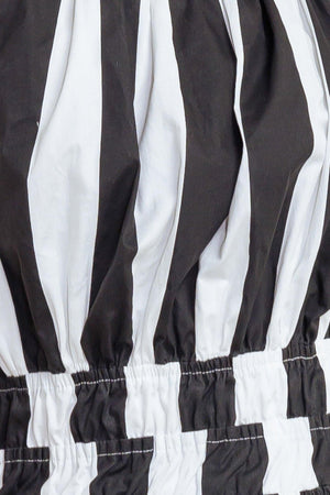 A striped woven midi dress featuring straight neckline, elasticized waist, bare back with cross strap and tie closure