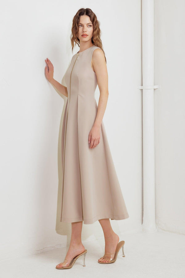 A solid woven midi dress featuring round neckline, sleeveless, front zipper closure and full skirt