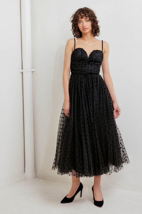 A dot tulle midi dress featuring sweetheart neckline, straps, full skirt and back zipper closure