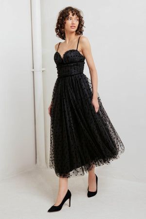 A dot tulle midi dress featuring sweetheart neckline, straps, full skirt and back zipper closure