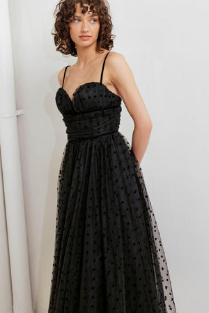 A dot tulle midi dress featuring sweetheart neckline, straps, full skirt and back zipper closure