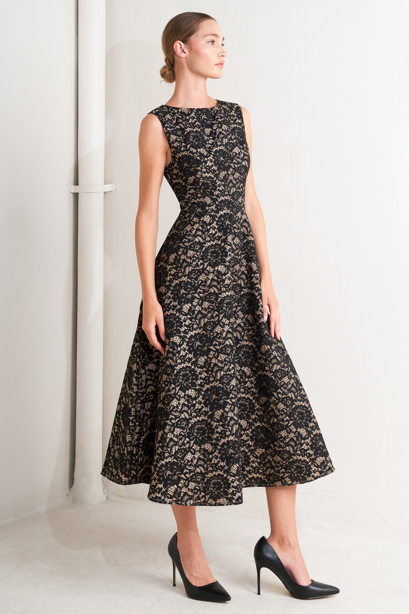 A woven lace midi dress featuring wide neckline, sleeveless, circle skirt and back zipper closure