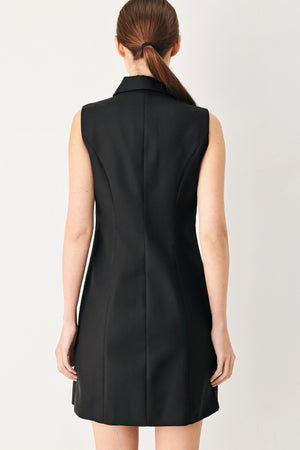 Woman wearing a black sleeveless mini dress featuring blazer collar and front button down | FREEMARKET