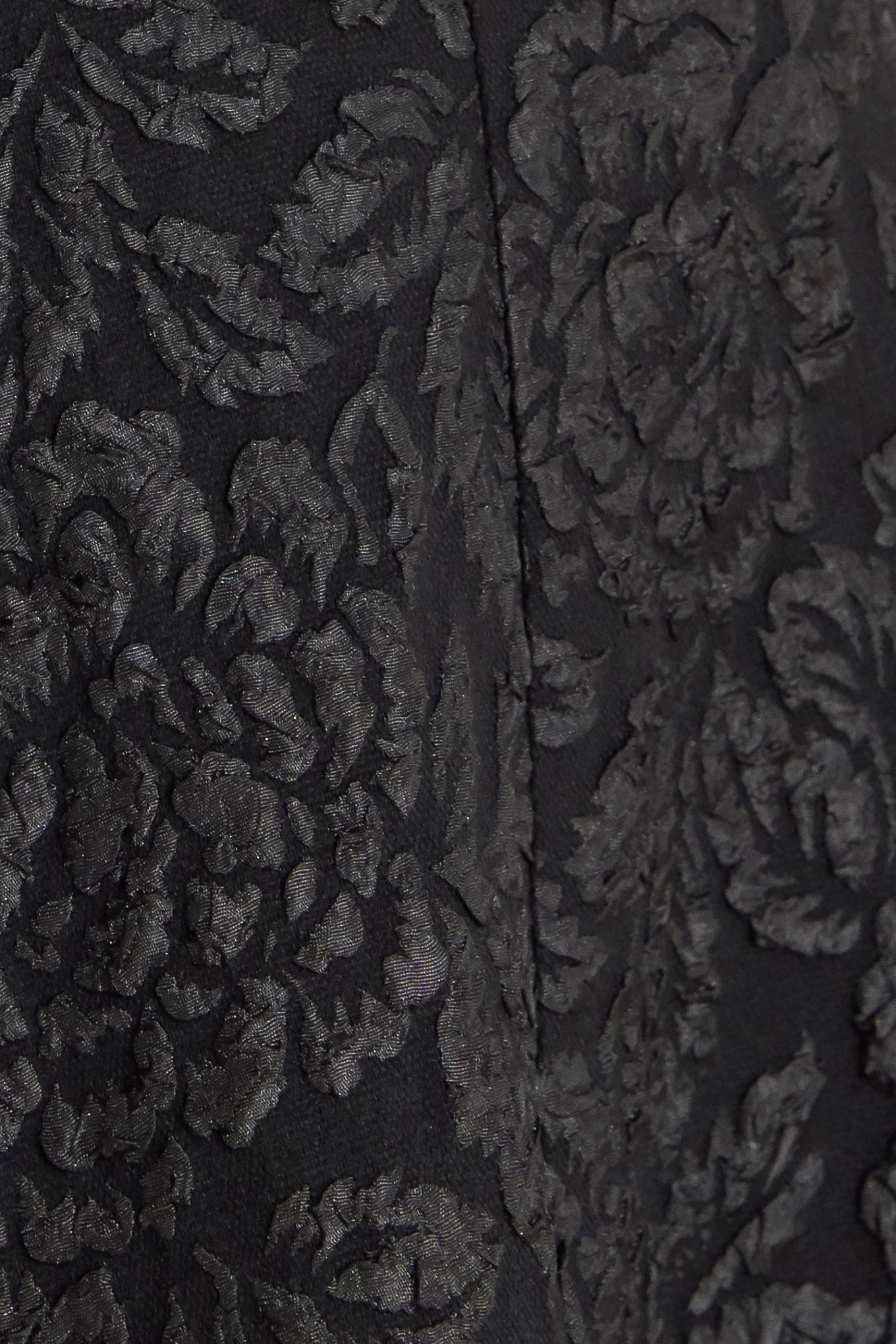 A jacquard woven midi dress featuring V neckline, sleeveless with back strap, circle skirt and back zipper closure