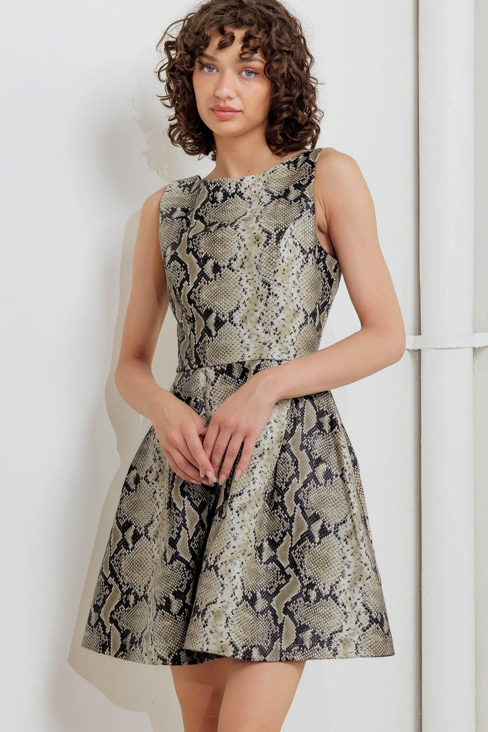 SNAKE GLAM FAUX LEATHER MINI DRESS.