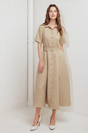 A textured woven midi dress featuring collar, short sleeve, button down, self belt and circle skirt