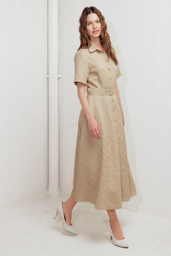 A textured woven midi dress featuring collar, short sleeve, button down, self belt and circle skirt
