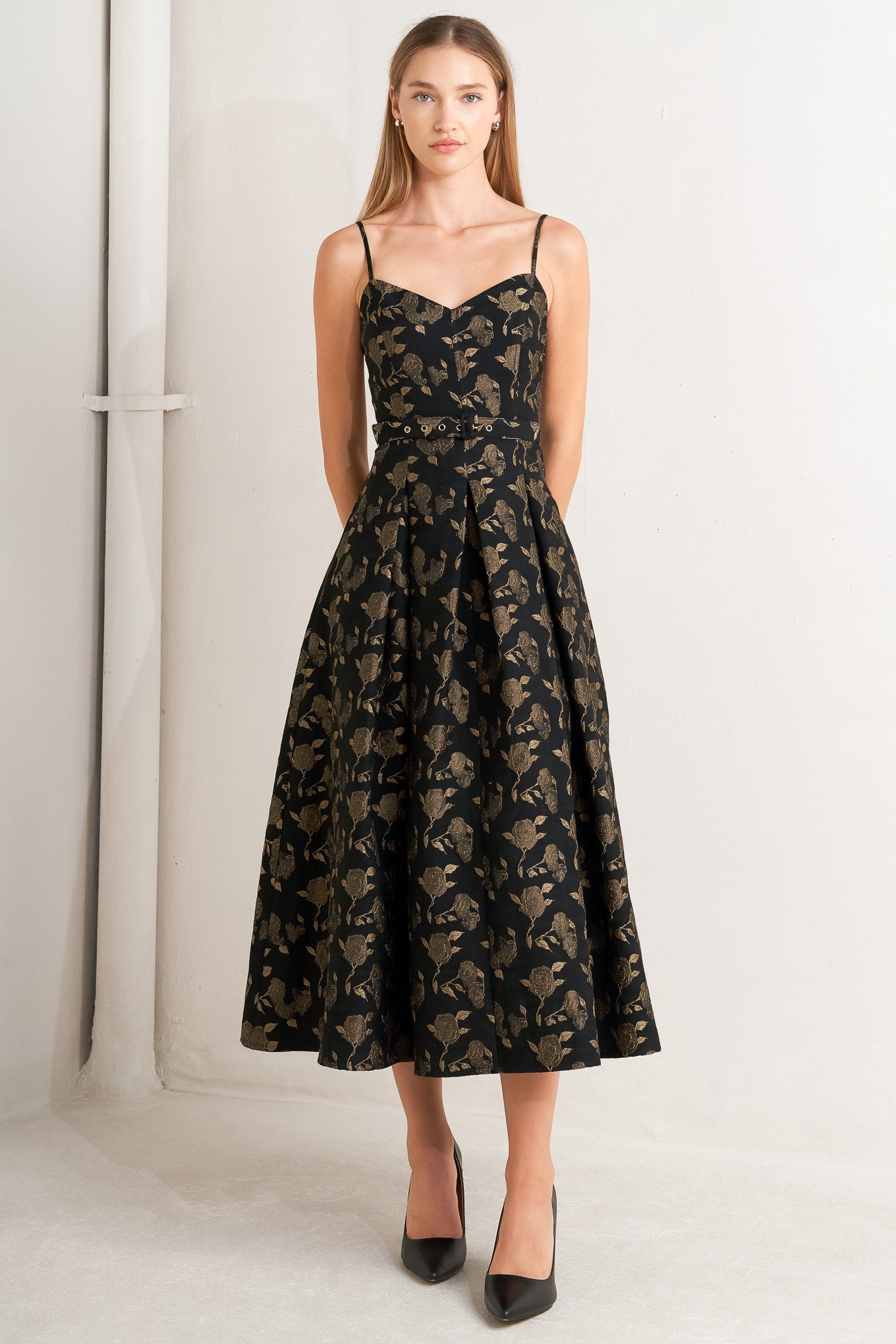 A jacquard woven midi dress featuring cami bodice, straps, self belt, full skirt and back zipper closure