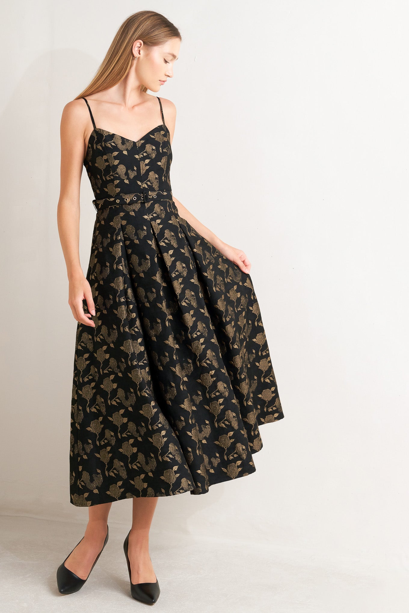 A jacquard woven midi dress featuring cami bodice, straps, self belt, full skirt and back zipper closure