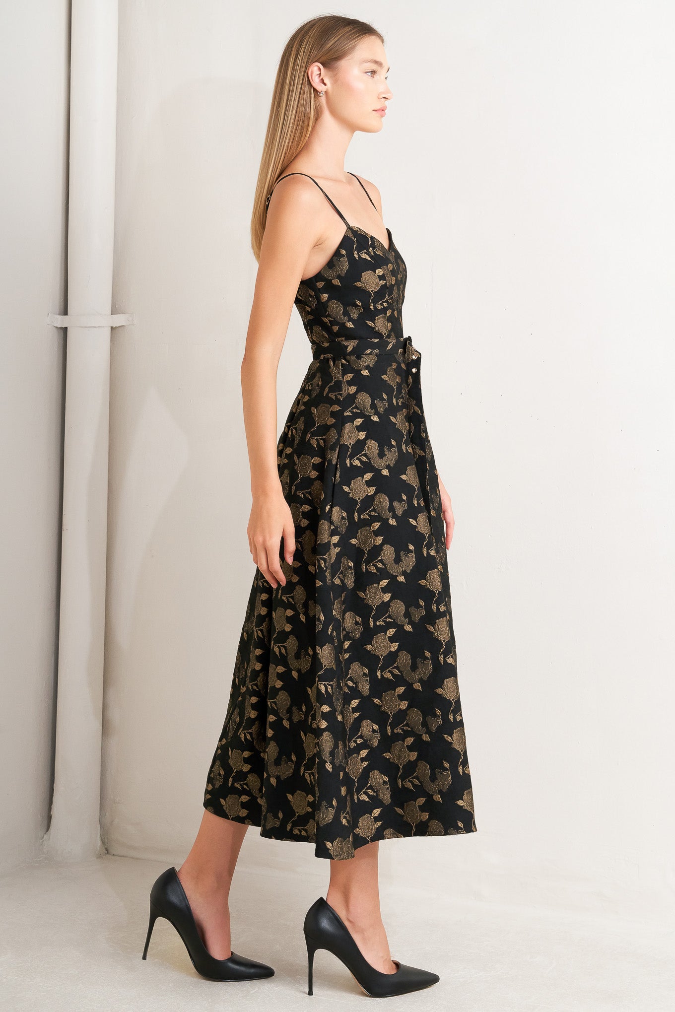 A jacquard woven midi dress featuring cami bodice, straps, self belt, full skirt and back zipper closure