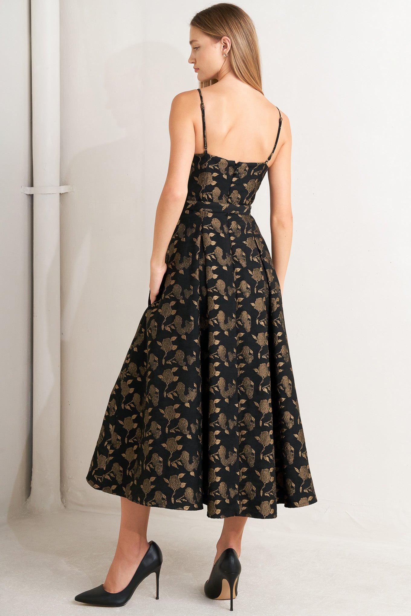 A jacquard woven midi dress featuring cami bodice, straps, self belt, full skirt and back zipper closure
