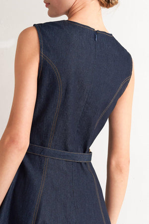 A denim midi dress featuring round neckline, sleeveless, self belt, circle skirt and back zipper closure
