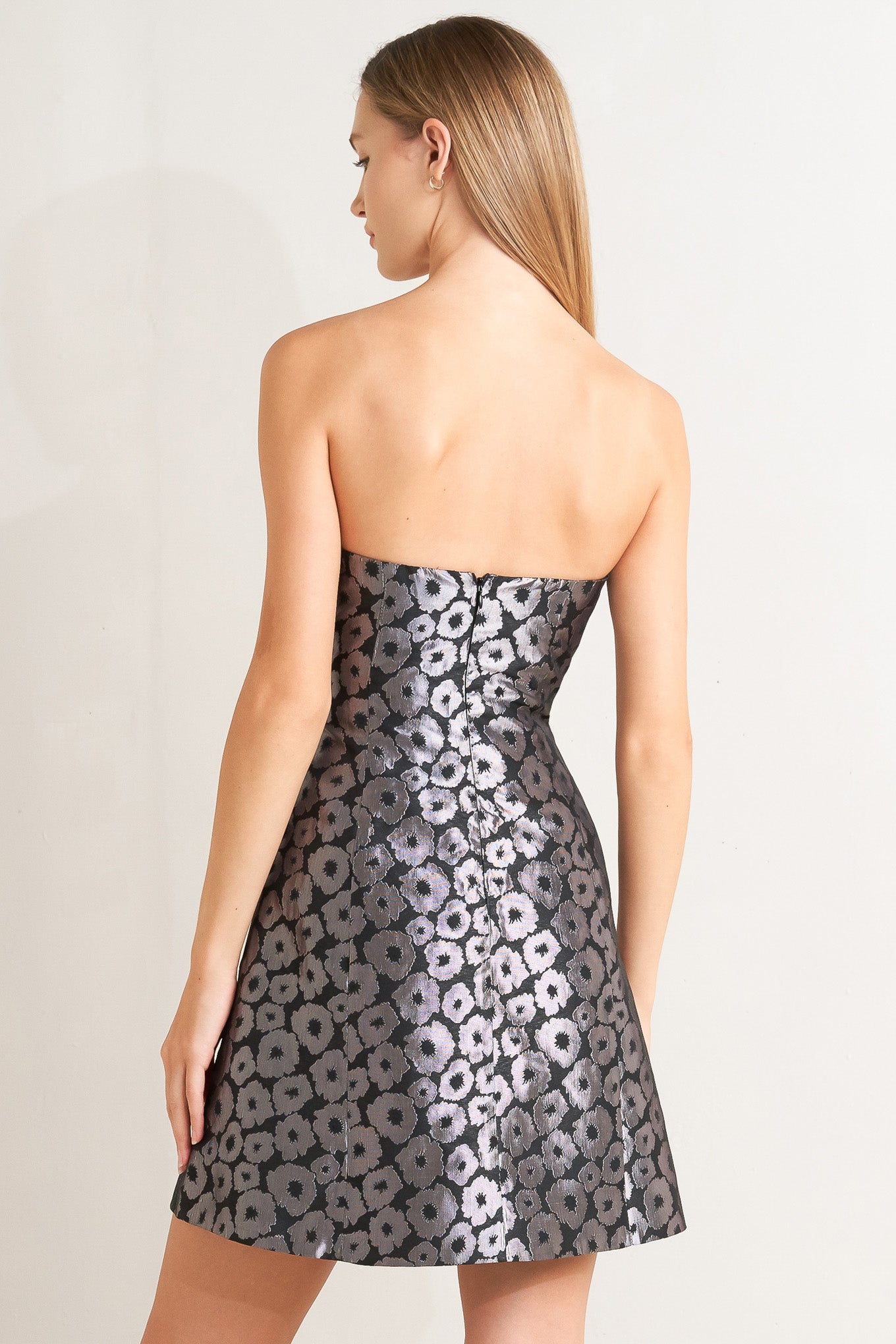 A woven jacquard mini dress featuring strapless, A line and back zipper closure