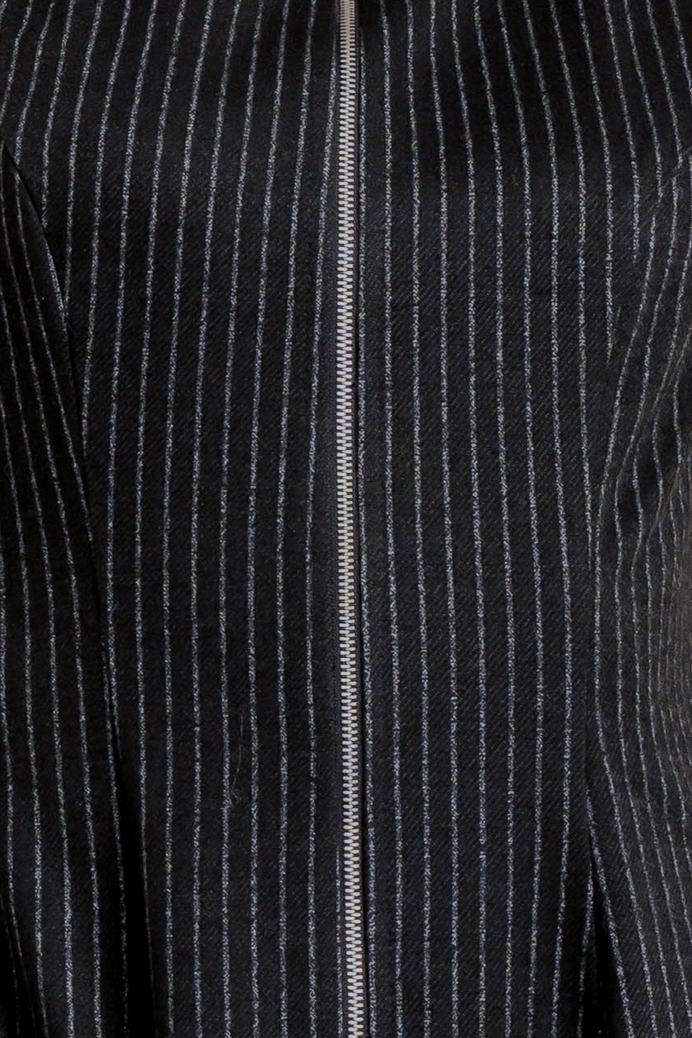 A striped woven midi dress featuring round neckline, sleeveless, circle skirt and front zipper closure