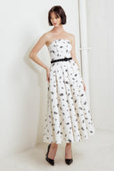 A printed textured woven midi dress featuring strapless neckline, contrasting belt, full skirt and back zipper closure