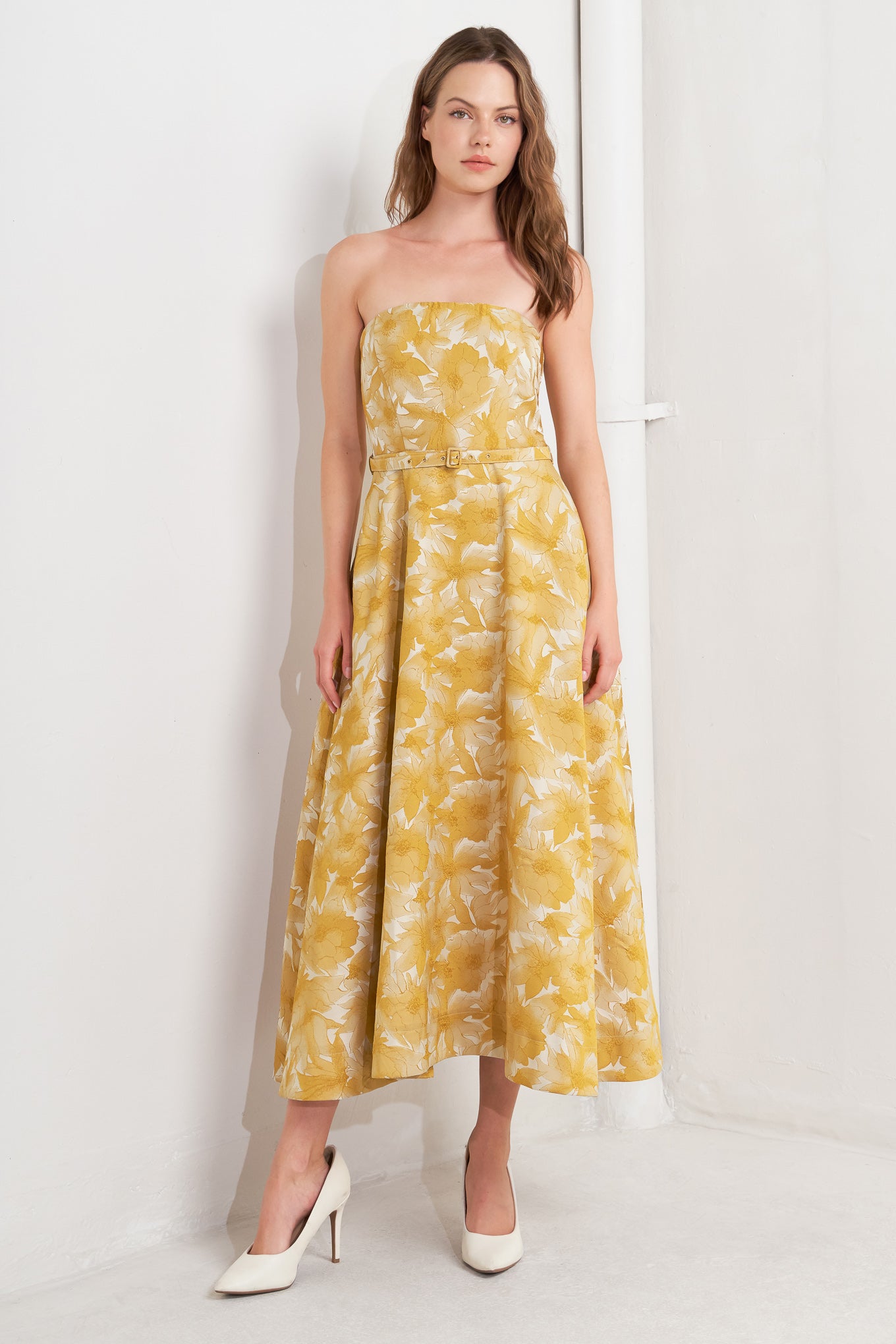 A woven jacquard midi dress featuring strapless, self belt, circle skirt and back zipper closure
