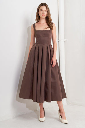 A solid woven midi dress featuring straight neckline, straps, full skirt, low back and zipper closure