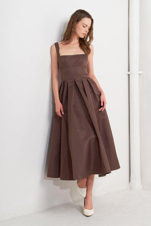 A solid woven midi dress featuring straight neckline, straps, full skirt, low back and zipper closure