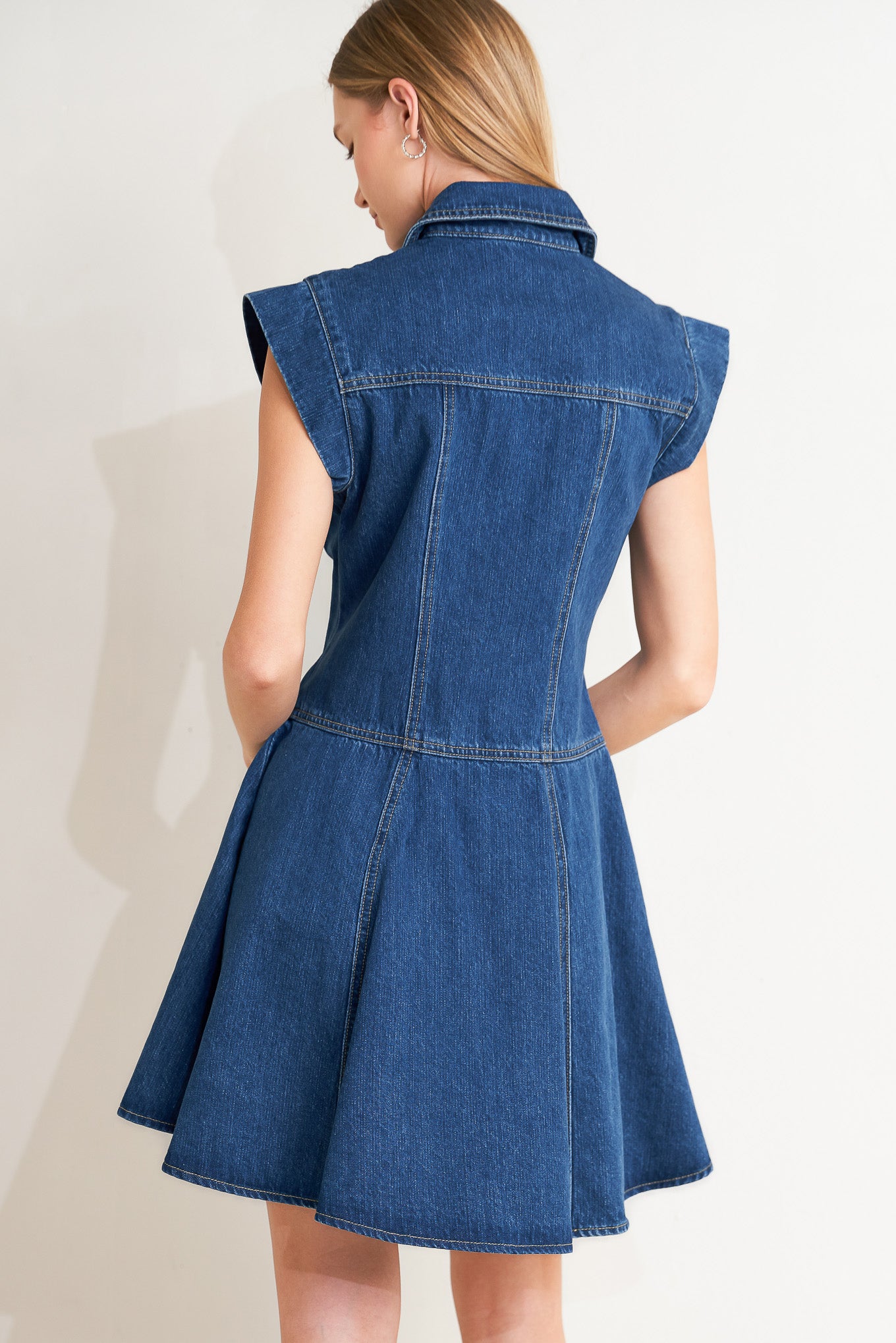 
A washed denim mini dress featuring collar, cap sleeve, button down, pockets and circle skirt

Details:

Self : 100% Cotton

Size &amp; Fit

- Model is 5`8" And Wearing Size Small
- Measurements Taken From Size Small
- Approx. Length: 36"