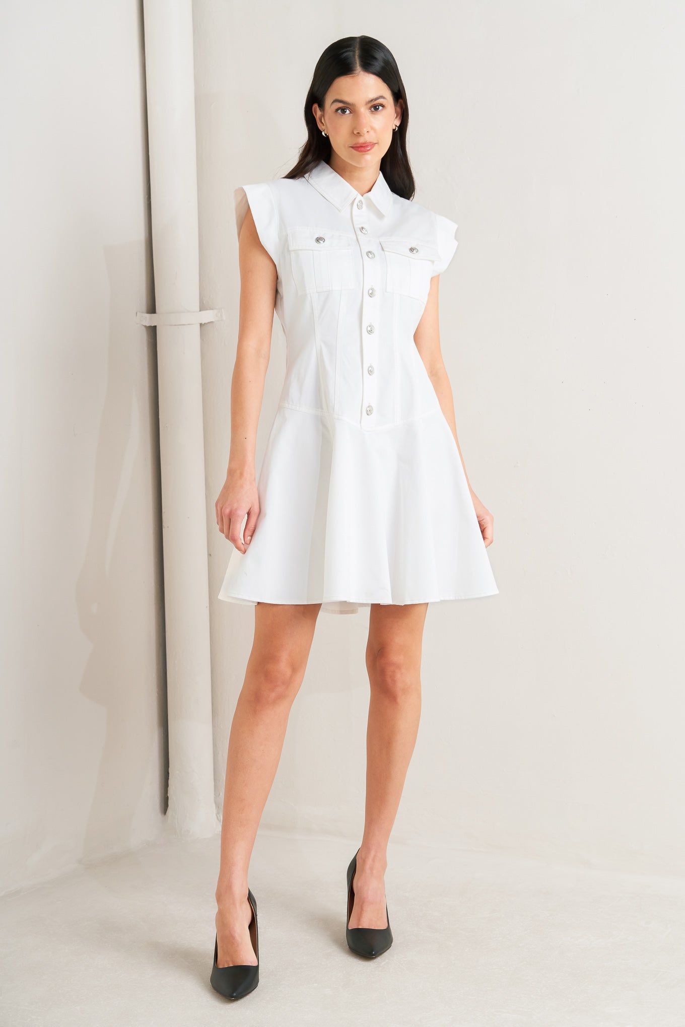 A solid woven mini dress featuring collar, short sleeve, front pocket, button down, drop waistline and circle skirt

Details:

Self: 100% Cotton

Size & Fit

- Model is 5`8" And Wearing Size Small
- Measurements Taken From Size Small
- Approx. Length: 34"