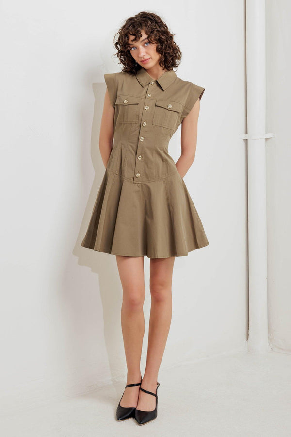 A solid woven mini dress featuring collar, short sleeve, front pocket, button down and circle skirt