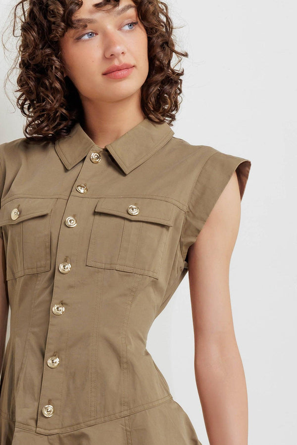 A solid woven mini dress featuring collar, short sleeve, front pocket, button down and circle skirt