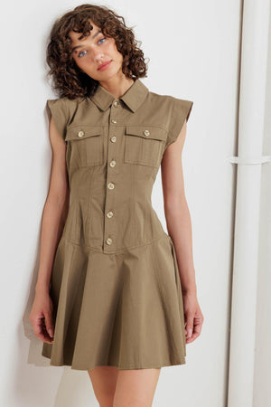 A solid woven mini dress featuring collar, short sleeve, front pocket, button down and circle skirt