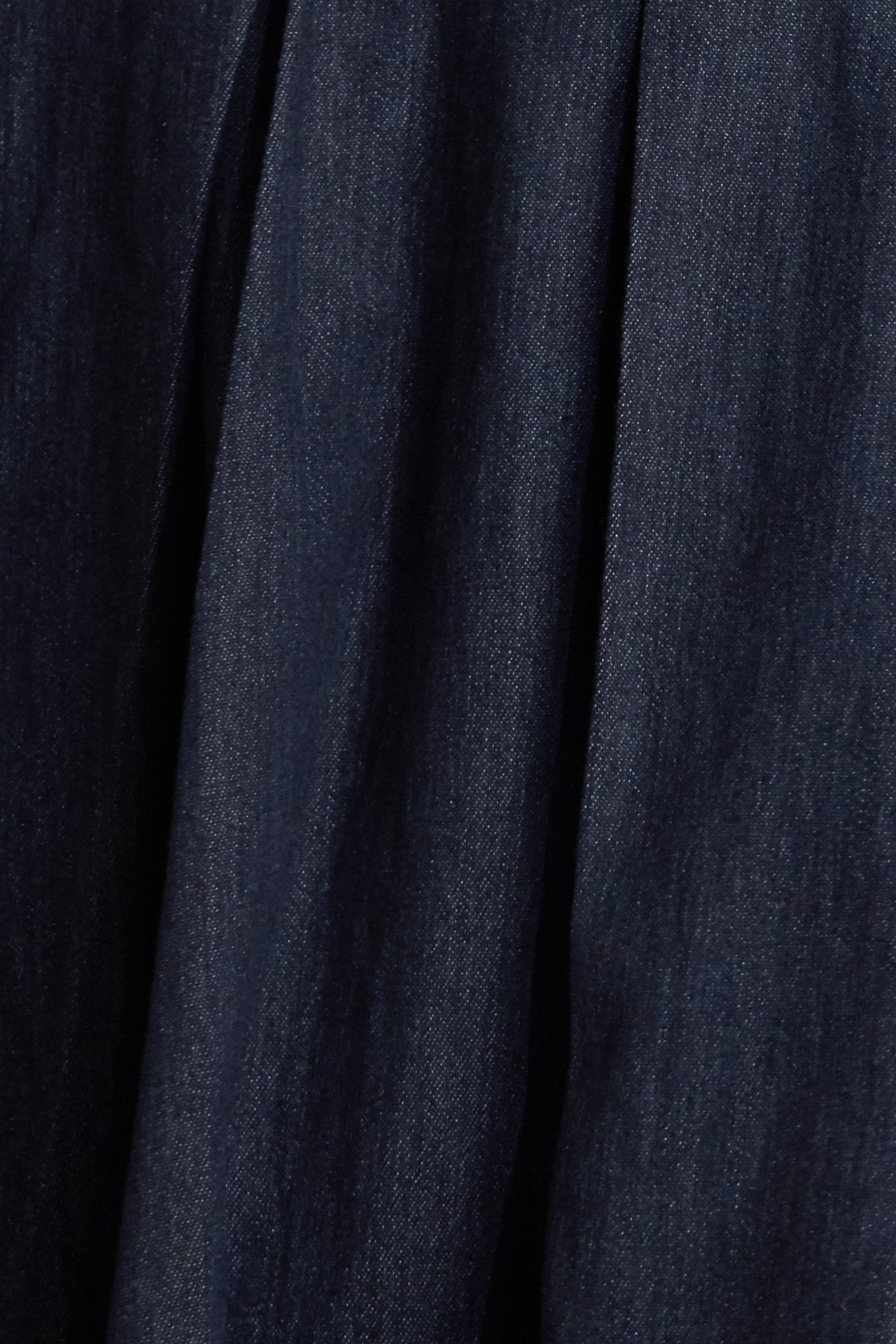 A denim midi dress featuring strapless sweetheart neckline, bustier bodice with button detail, basque waist, full skirt and back zipper closure