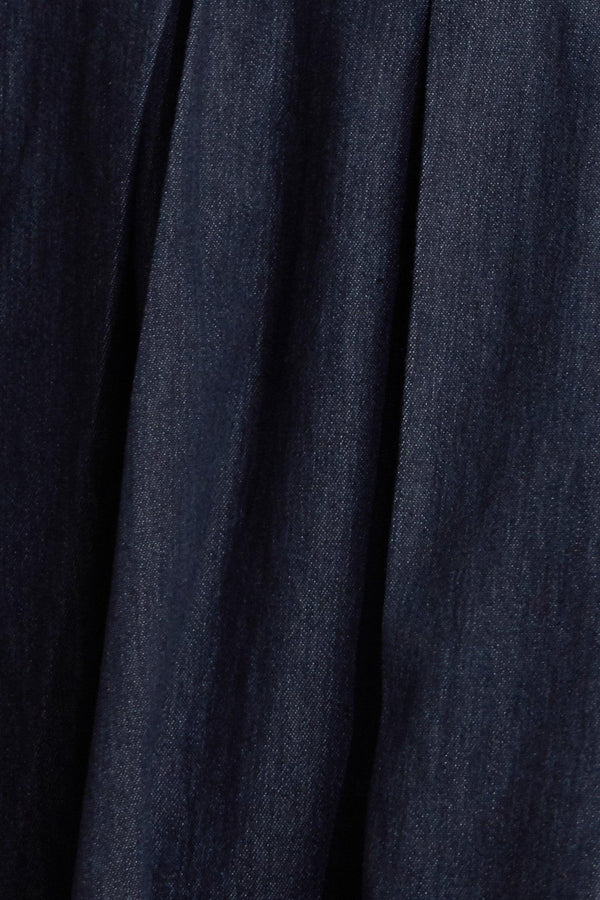 A denim midi dress featuring strapless sweetheart neckline, bustier bodice with button detail, basque waist, full skirt and back zipper closure