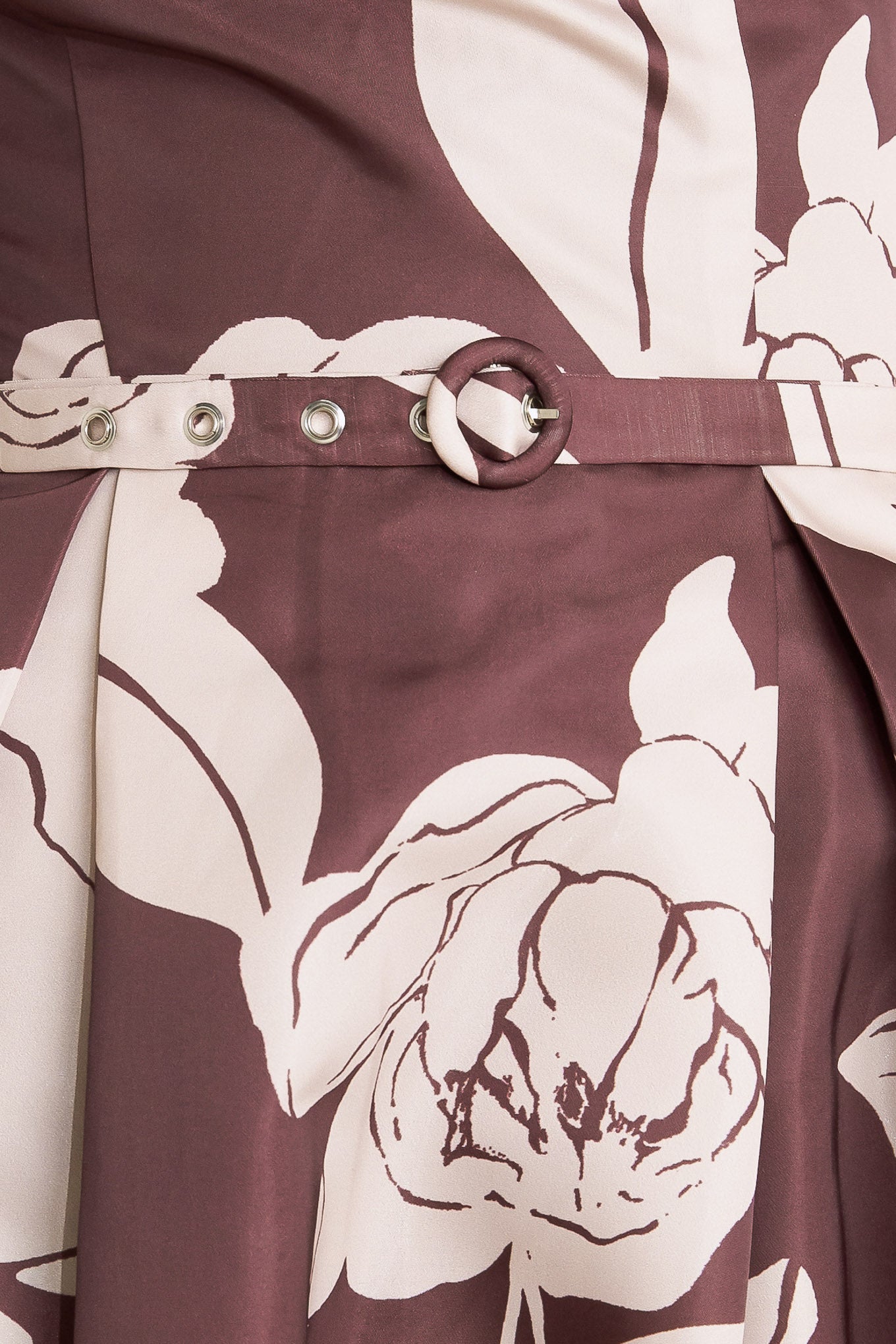 A printed woven midi dress featuring strapless, self belt, full skirt and back zipper closure
