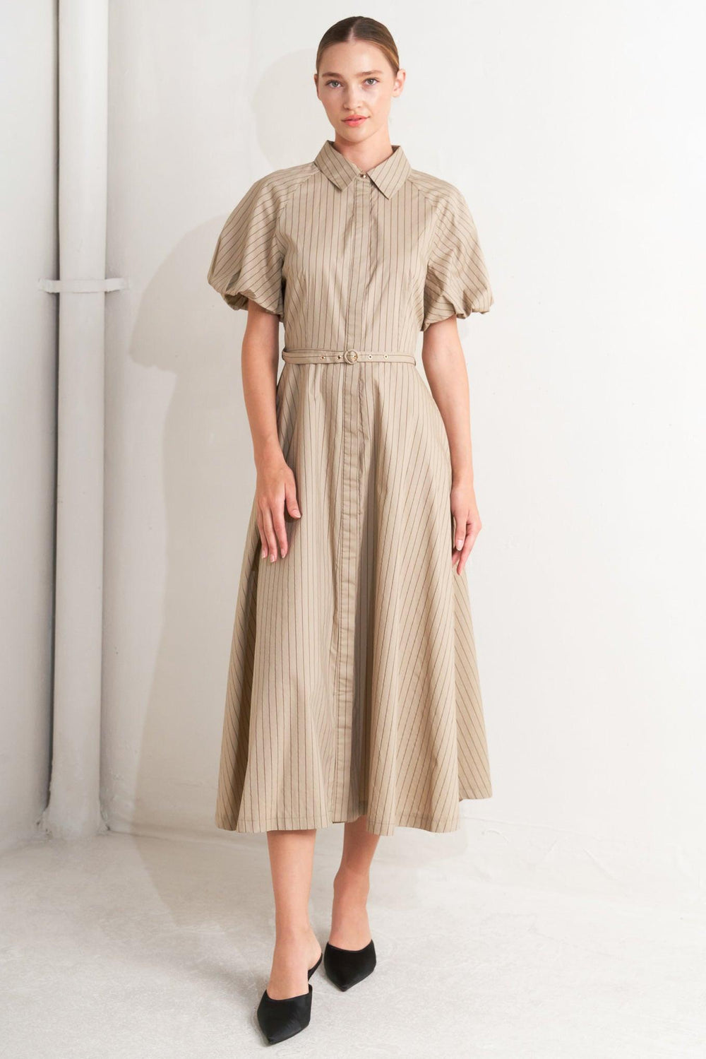 A striped woven midi dress featuring collar, raglan short puff sleeve, hidden button down, self belt and circle skirt